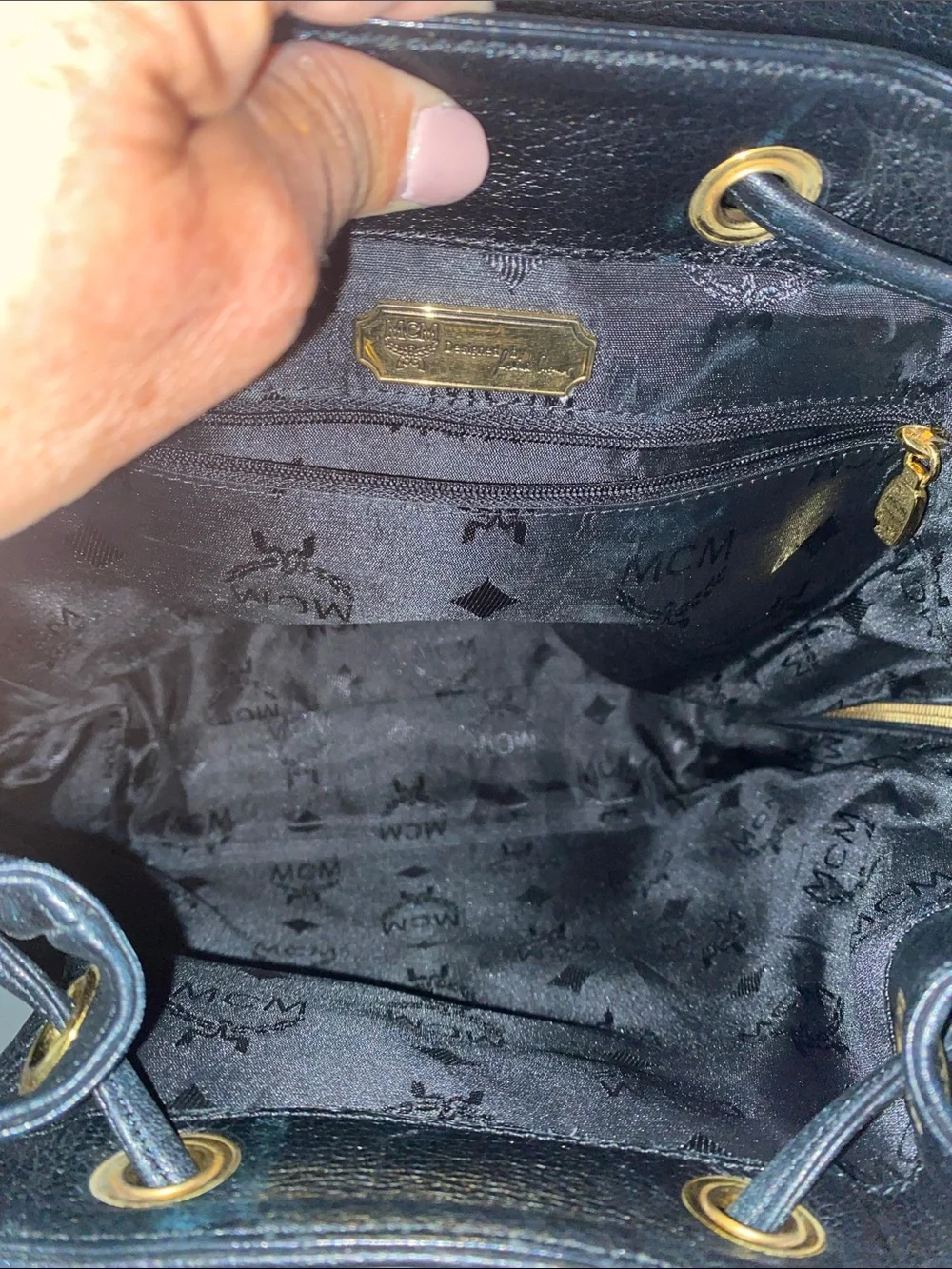 MCM Black Pebbled Leather Backpack with Gold Emblem Hardwarer
